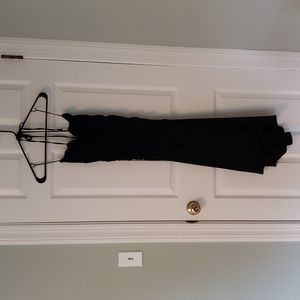 Moda International size 6 black fitted dress, tie neck, ruched top and hi-lo hem